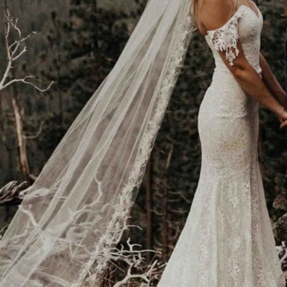 Off-shoulder lace couture wedding dress